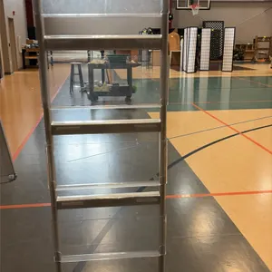 Freestanding literature display rack. Features a silver-tone metal frame with 4 tiered clear acrylic pamphlet pockets. Freestanding base with dual sta