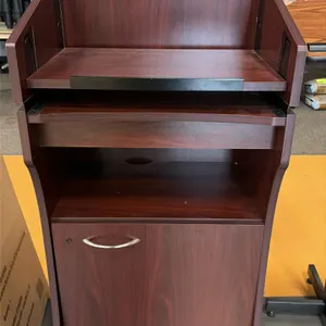 Oklahoma Sound Aristocrat floor sound lectern. Features woodgrain laminate construction, slanted reading surface with book stop, pull-out shelf, open 