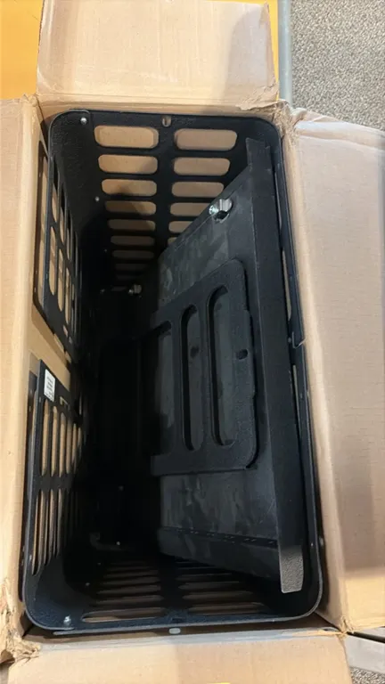 Chief Projector Guard security cage. Features steel construction with a textured black powder-coat finish, slotted ventilation, and internal mounting