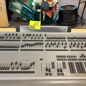ETC Express 48/96 lighting control console. Features two-tier channel faders, 24 submasters, dual timed crossfaders, numeric keypad, and LCD display p