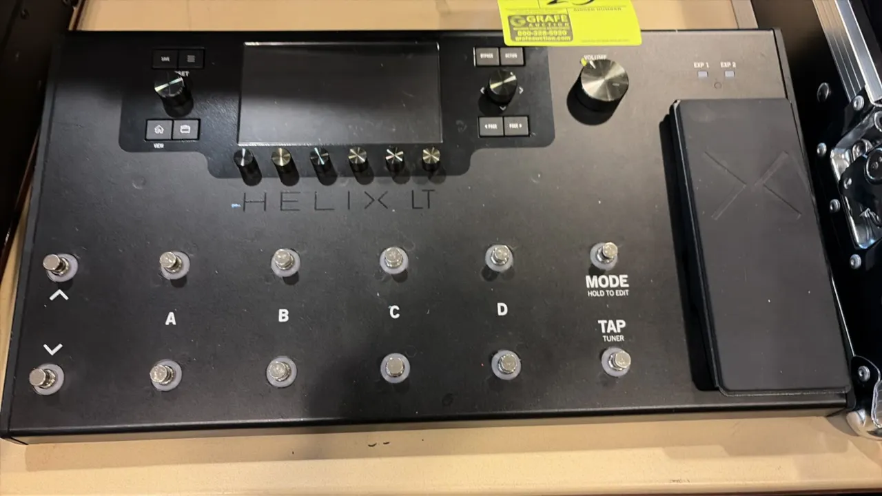 Line 6 Helix LT guitar multi-effects processor pedal. Features integrated expression pedal, color LCD screen, 12 capacitive footswitches, and preset a