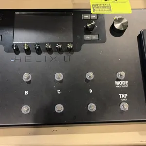 Line 6 Helix LT guitar multi-effects processor pedal. Features integrated expression pedal, color LCD screen, 12 capacitive footswitches, and preset a