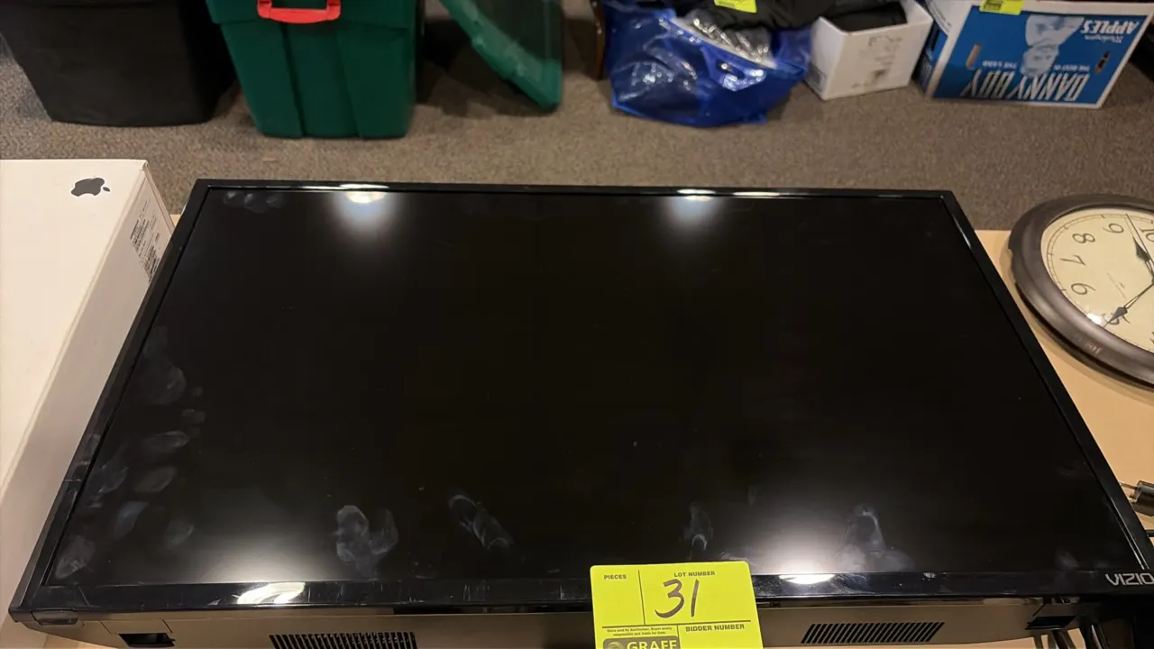 Vizio 32" flat-screen television. Features a black bezel and integrated bottom speakers.