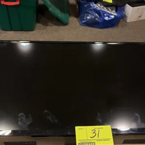 Vizio 32" flat-screen television. Features a black bezel and integrated bottom speakers.