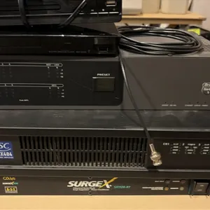 Audio and video equipment lot. Includes a Jinhoo DVD/CD player, Sony Blu-ray/DVD player, Rane RPM 44 programmable multiprocessor, QSC CX404 4-channel 