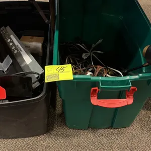 Assorted lot of desk lamps, extension cords, power strips, and miscellaneous hardware. Includes adjustable desk lamps, various power cords, and (2) pl