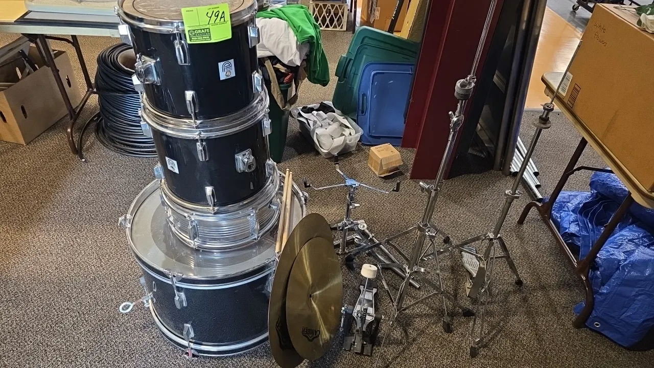 Percussion Plus 4-piece drum set with hardware and cymbals. Includes bass drum, (2) tom drums, chrome-finish snare drum, (2) Camber cymbals, bass drum