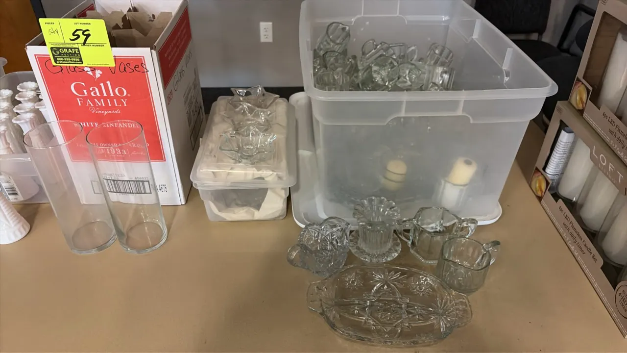 Assorted glassware lot. Includes clear glass cylinder vases with divided box, star-shaped glass candleholders, divided starburst relish dish, creamers