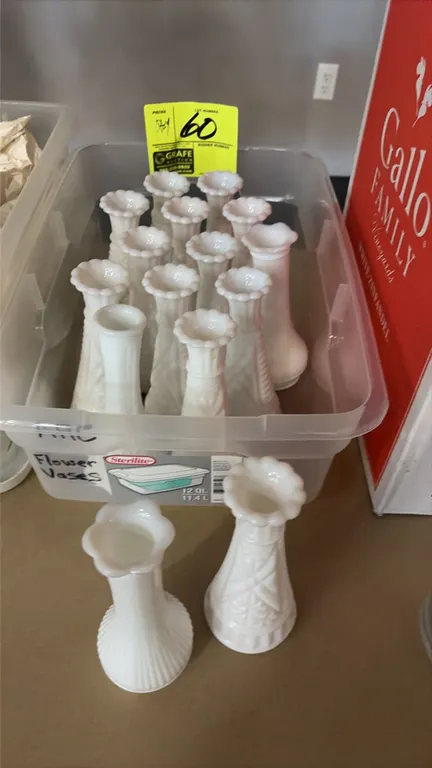 Collection of white milk glass floral bud vases. Features assorted pressed glass patterns including ribbed, fluted, and embossed geometric designs wit