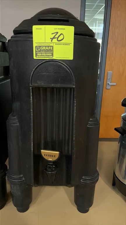 Cambro insulated hot and cold beverage dispenser. Features black molded construction, front dispensing spigot with "Coffee" label plate, molded side c