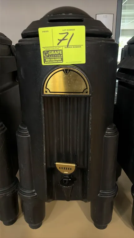 Cambro insulated hot and cold beverage dispenser. Features black molded polyethylene construction, front dispensing spigot with "COFFEE" label, brass-