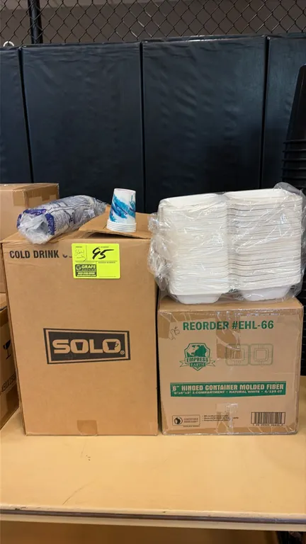 Solo wax paper cold drink cups and Empress Earth EHL-66 6" hinged molded fiber containers. Includes one case of wax treated paper cups and one case of
