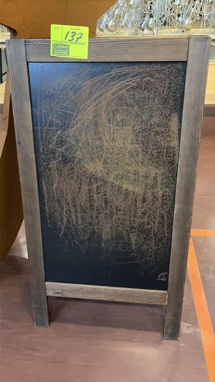 Wooden A-frame chalkboard sign stand. Features a folding wood frame and double-sided chalkboard display surfaces.