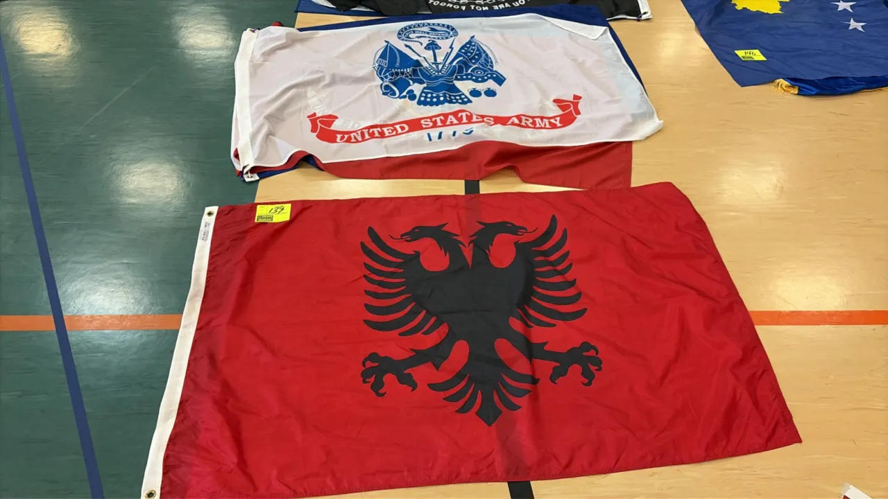 Assorted flags. Includes United States military branch flags (U.S. Army, U.S. Marine Corps, U.S. Air Force, U.S. Coast Guard), POW/MIA flag, and Alban