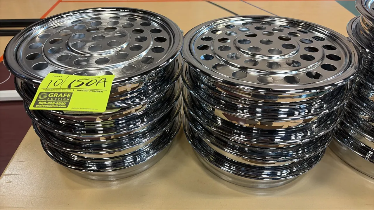Stainless steel wine and grape juice service platters. Features perforated insert discs designed to hold service cups and stackable polished base tray
