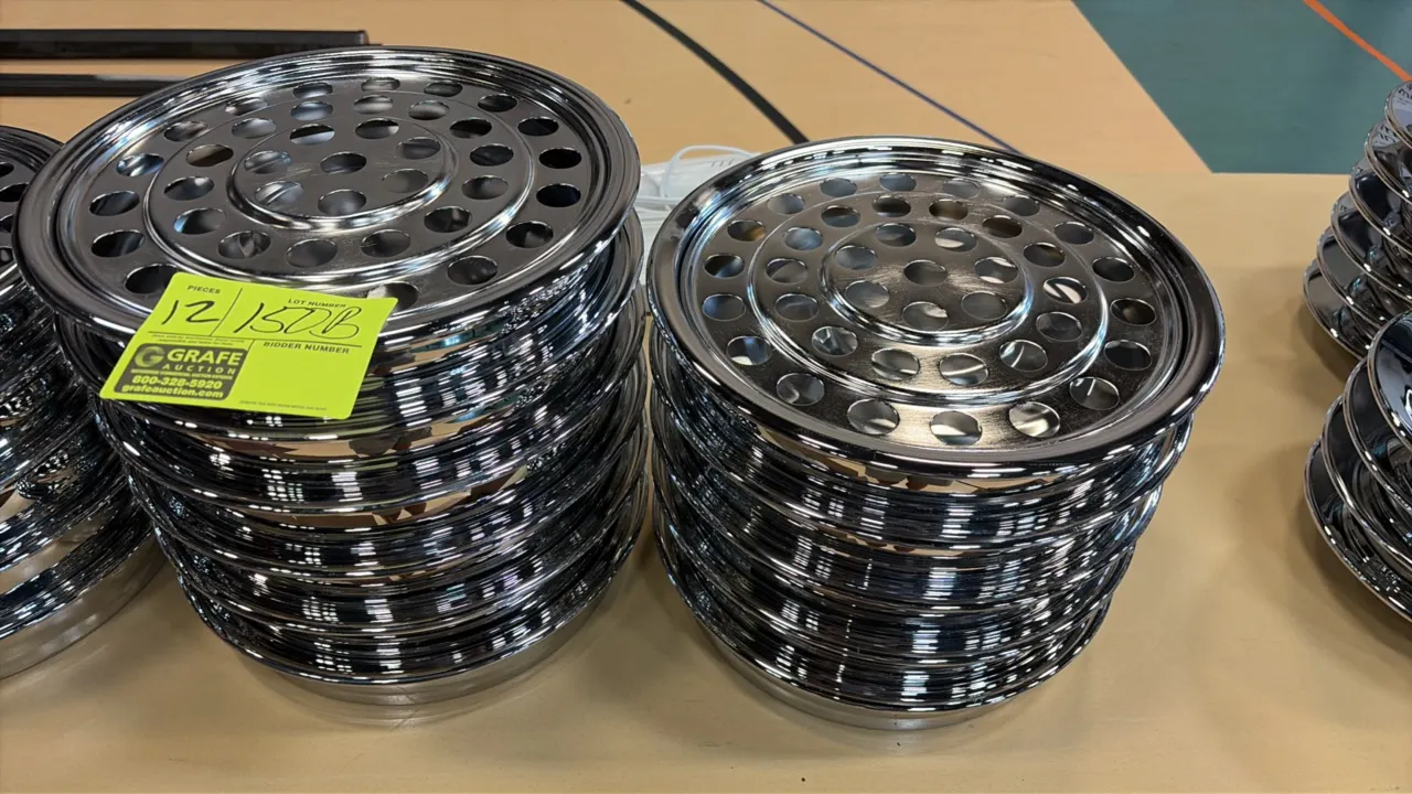Stainless steel wine and grape juice service platters. Features perforated insert trays designed for small glasses or cups. 12" Dia.