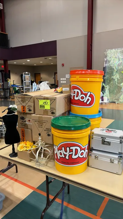 Assorted event decor and storage lot. Includes boxes of artificial flowers, miniature dress form display, decorative wire crown, (3) empty plastic Pla