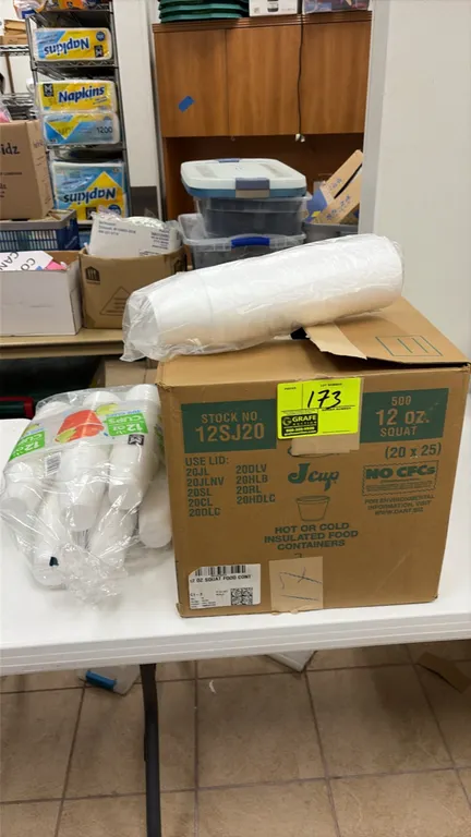 Assorted disposable drinkware and food containers. Includes a case of Dart 12SJ20 12 oz squat insulated foam food containers with additional sleeves a