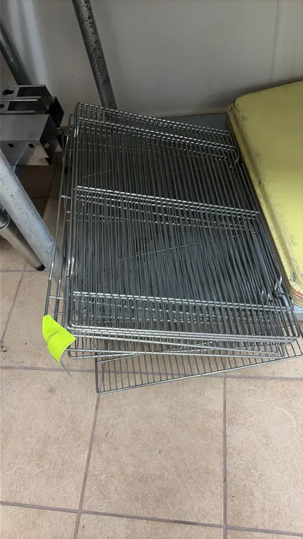 Stainless steel wire drying racks. Features wire grid construction with integrated side support rails.