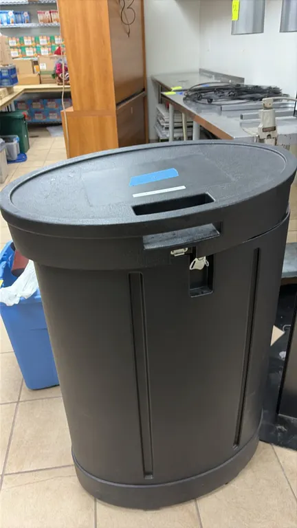 10' curved pop-up floor display. Features collapsible frame, magnetic channel rails, rolled display panels, and hardware. Housed in a heavy-duty molde