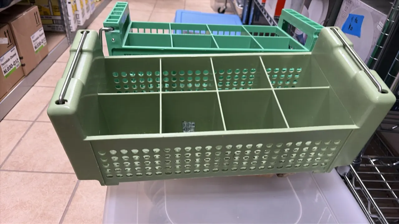 Dishwasher silverware holders. Features 8-compartment molded plastic construction, perforated drainage designs, and folding wire handles.