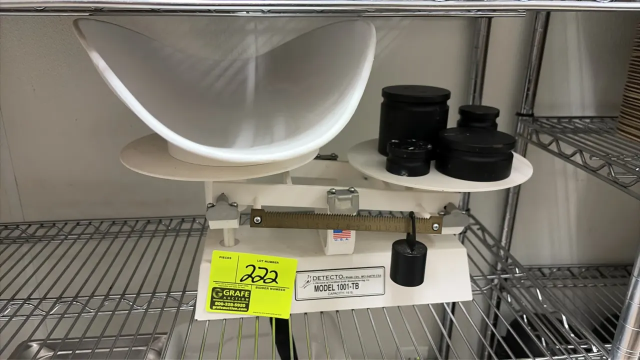 Detecto 1001-TB mechanical baker's beam scale. Features a 16 lb capacity, dual plates, graduated tare beam with sliding weight, plastic scoop, and cou