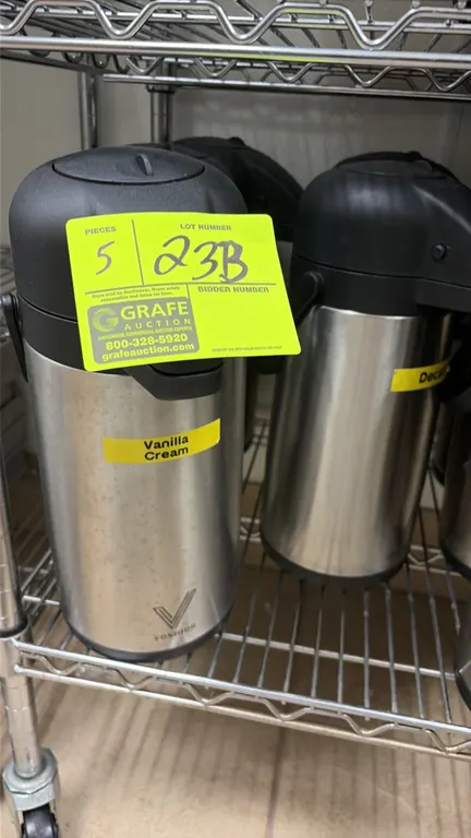 Vondior insulated thermal airpots. Features stainless steel construction, black pump-action dispensing lids, and integrated carrying handles. Wire she