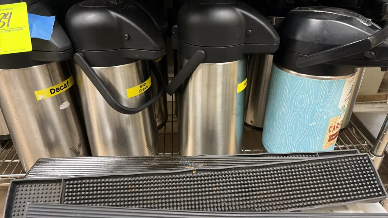 Insulated thermal airpots. Features stainless steel bodies, pump-action dispenser lids, and carrying handles. Includes rubber counter drip mats.