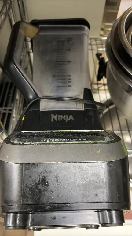 Ninja countertop blender. Features a graduated pitcher with handle and lid, and push-button controls for Power, Pulse, Low, Medium, and High settings.