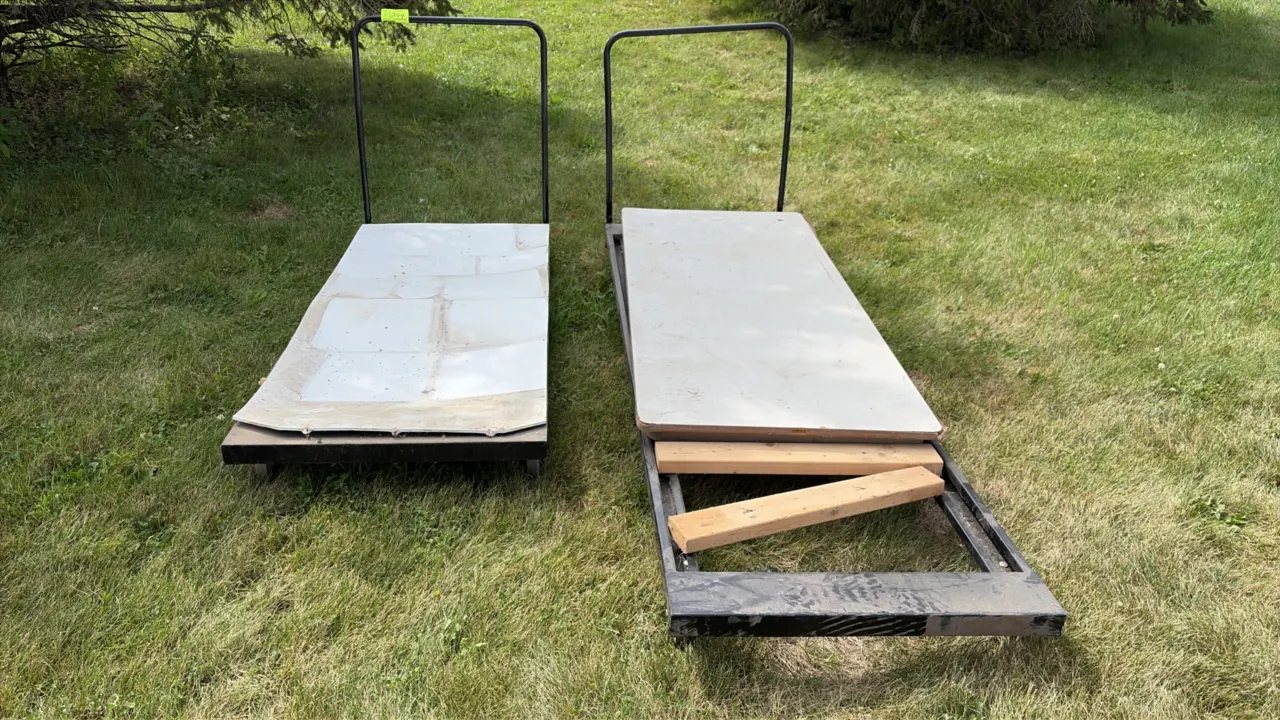 Metal portable chair carts. Features tubular steel push handles and platform frames. Mounted on casters. Note: One cart is missing deck section.