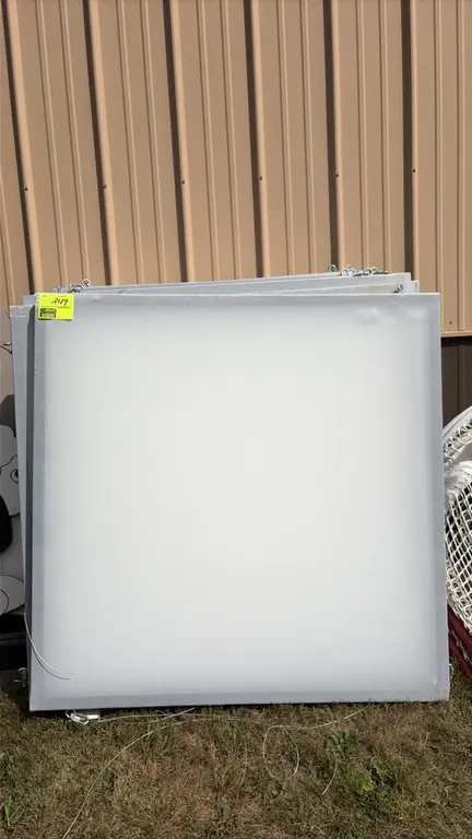 Hanging screens. Features white panels in square frames with integrated eye-bolt hardware and hanging wire. Dimensions: 4' x 4'.