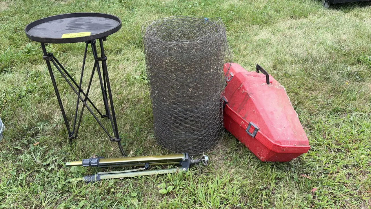 Lawn and garden utility lot. Includes a round metal planter table with folding stand, a roll of chicken wire netting, an adjustable tripod impact spri