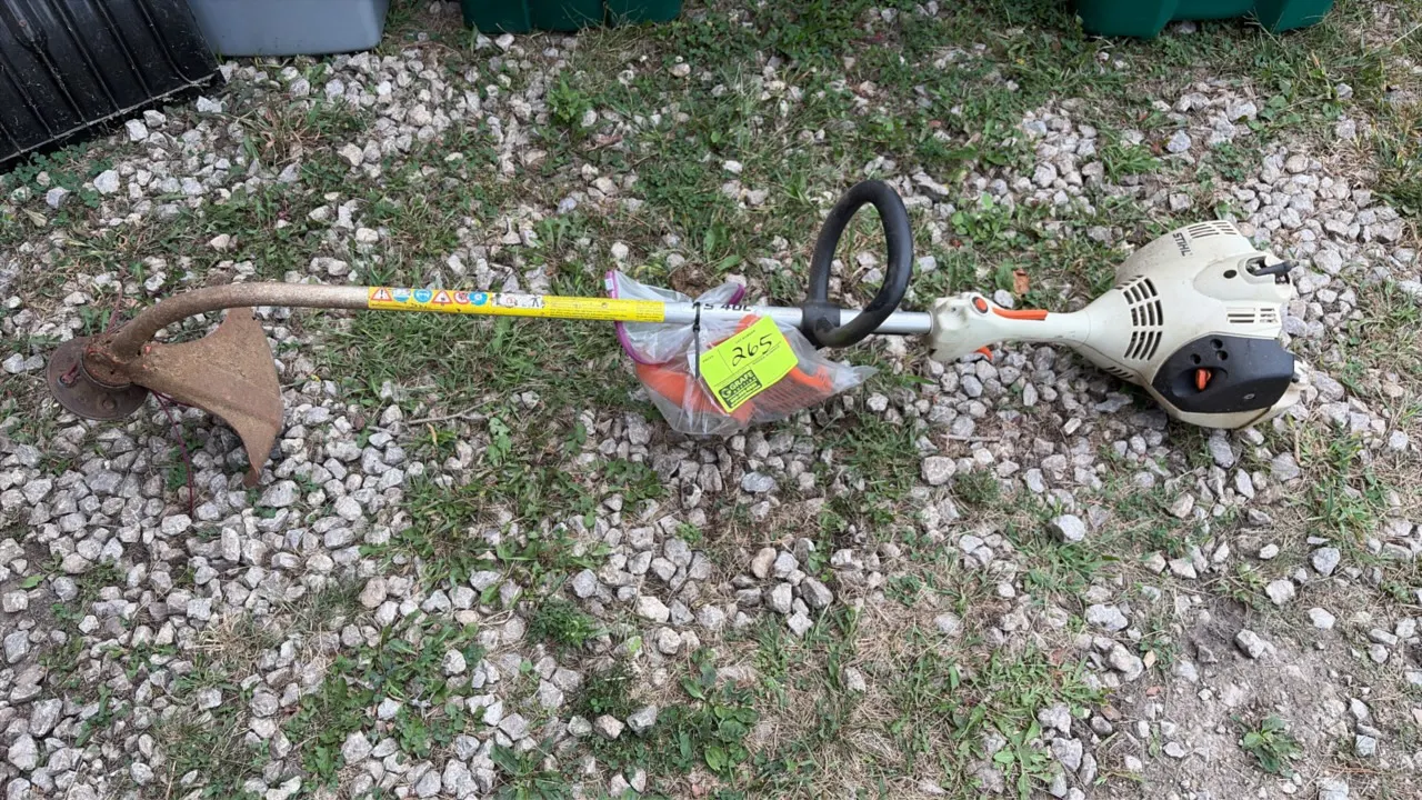 Stihl FS 40 C gas string trimmer. Features a curved shaft, loop handle, throttle control, and protective debris guard.
