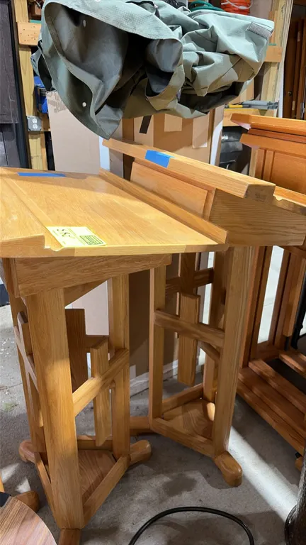 Wood podiums. Features light-finish wood construction, angled reading tops with book stop ledges, open pedestal columns with decorative cross motifs,