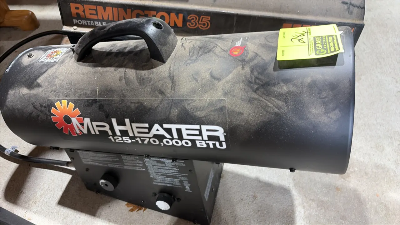 Mr. Heater portable forced air propane heater. Output: 125,000 to 170,000 BTU. Features top carrying handle and base-mounted controls. Background equi