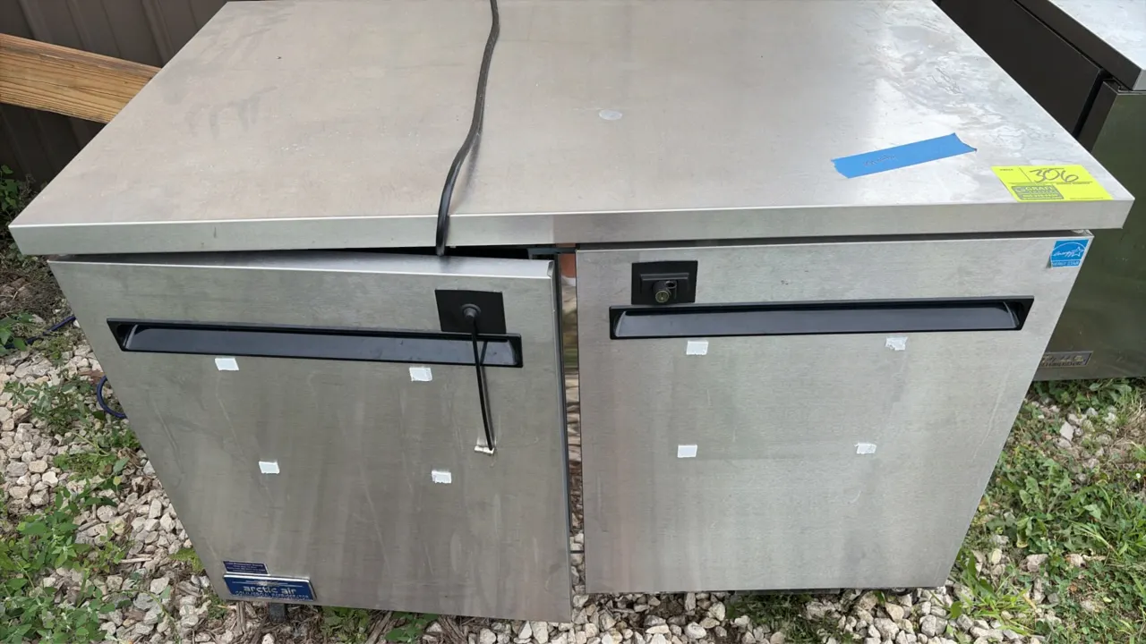 Arctic Air AUC48RZ self-contained undercounter commercial refrigerator. Features stainless steel exterior, two solid doors with recessed handles and i