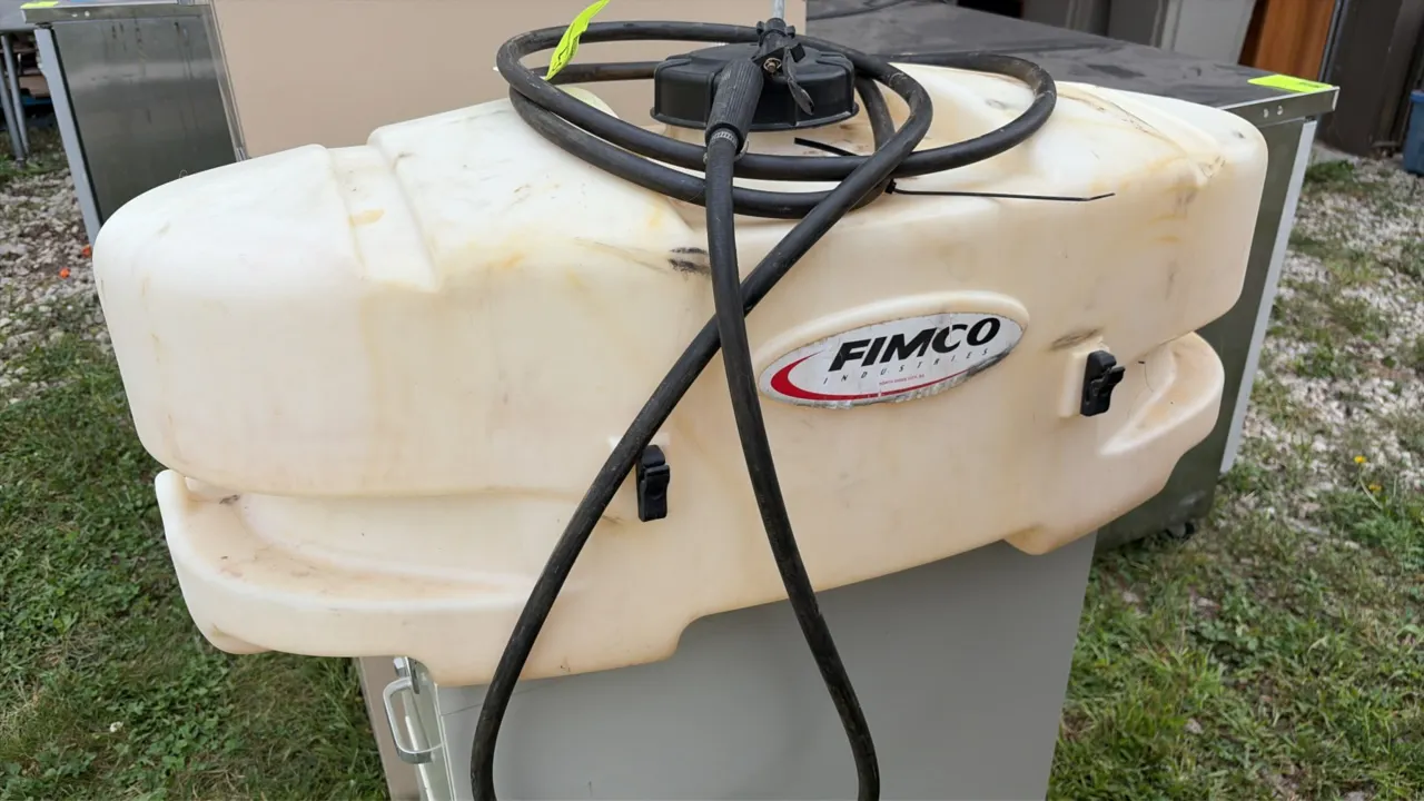Fimco 25-gallon tank sprayer. Features molded polyethylene tank, threaded fill cap, spray wand with hose, and integrated wand clips.