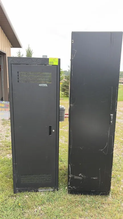 Metal component rack cabinets. Features steel construction with a black finish, vented door panels, latch handles, and interior rack mounting rails. I