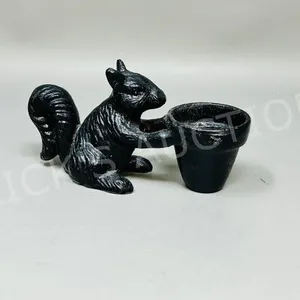 5" long cast metal squirrell w/ flower pot - 3" h