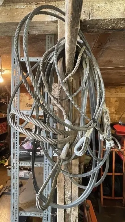 Assorted drive belts and wire rope slings.
