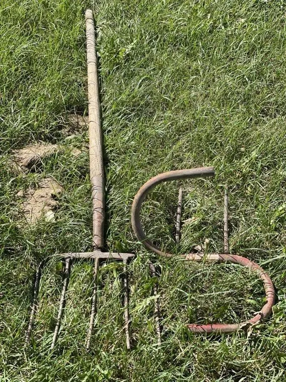 Vintage pitchfork and a manual bale fork.