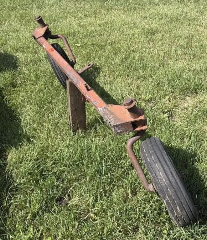 Implement axle and steering assembly