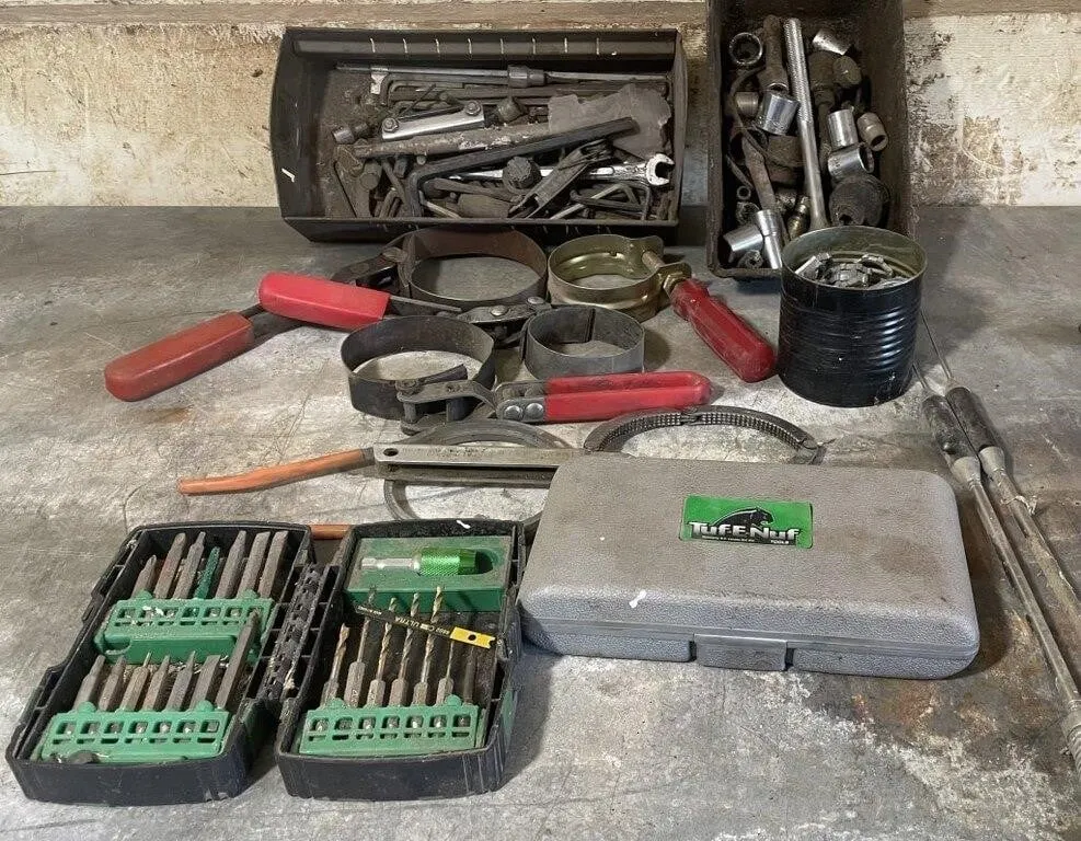 Assortment of oil filter wrenches, drill bits and