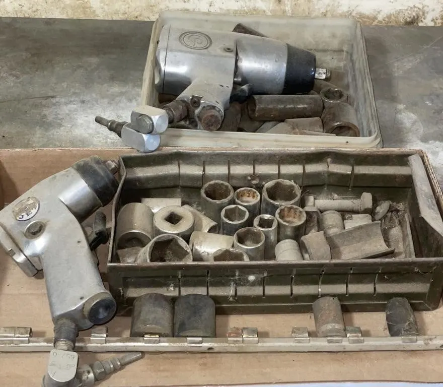 Two air impact wrenches and assortment of
