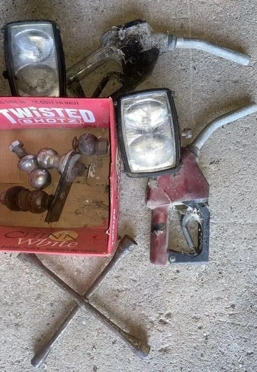 Two gas nozzles, trailer hitch balls, tire wrench