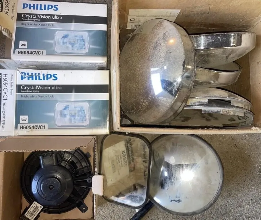 Variety of auto parts. Includes hub caps for a