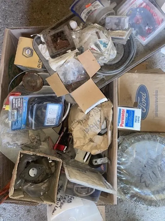 Assortment of new and used auto parts. Includes
