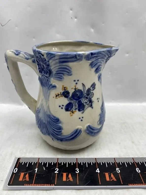 Blue and white floral pottery pitcher