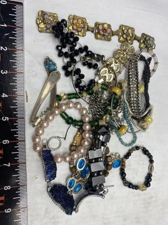 Assorted costume jewelry lot: bracelets, beads,