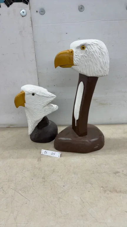 Two Hand-Carved Wooden Bald Eagle Head Sculptures on Pedestals, 14” and 22 1/2” by Local Artist
